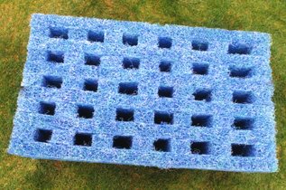 Blue filter matting designed for use in water garden filtration systems, featuring multiple holes for water flow.