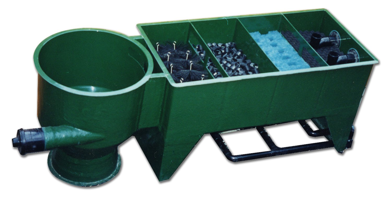 Multi-chamber water filter with various compartments for filtration media and water flow management.